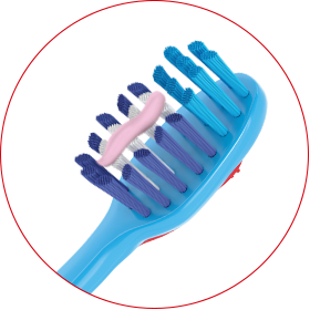 Bright blue toothbrush with pink nurdle of toothpaste on it